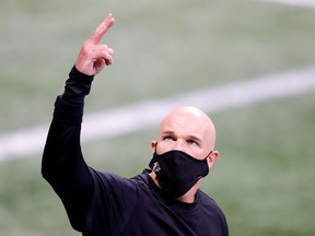 Head coach Dan Quinn of the Atlanta Falcons walks out on the field during pregame warmups prior to facing the Carolina Panthers at Mercedes-Benz Stadium on October 11, 2020 in Atlanta, Georgia.