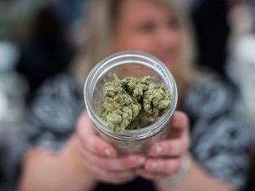 Marijuana being offered in a jar.