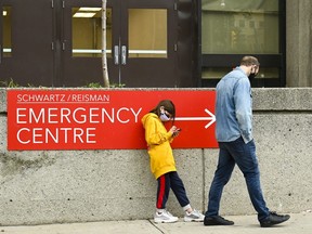 People wait in line for hours at a COVID assessment centre at Mount Sinai Hospital on Sept. 24, 2020