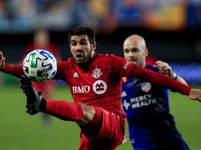 Toronto FC midfielder Alejandro Pozuelo  plays the ball against FC Cincinnati.