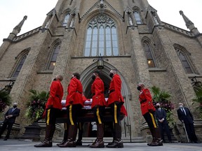 RCMP pallbearers carry the flag-draped coffin of the late former Prime Minister John Turner during his state funeral at St. Michael's Cathedral Basilica in Toronto, Oct. 6, 2020.
