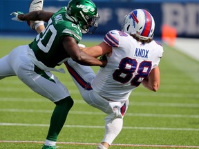Bills' Dawson Knox makes a catch against Marcus Maye of the New York Jets.