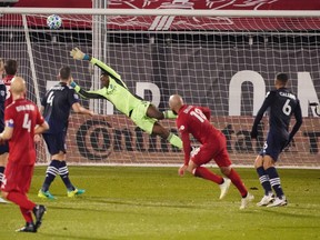New York City FC goalkeeper Sean Johnson dives for a shot by Toronto FC on Wednesday night.