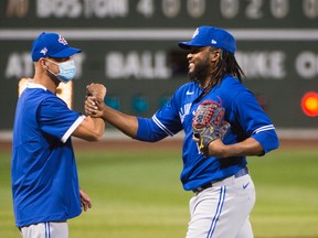 Rafael Dolis (right) had his option picked up by the Toronto Blue Jays on Friday.