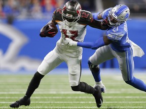 Dec 15, 2019; Detroit, MI, USA; Tampa Bay Buccaneers wide receiver Chris Godwin (12) stiff arms Detroit Lions defensive back Tracy Walker (21) during the second quarter at Ford Field. Mandatory Credit: Raj Mehta-USA TODAY Sports ORG XMIT: USATSI-403374