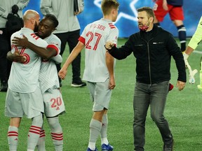 Toronto FC head coach Greg Vanney (right) celebrates a win earlier this season.