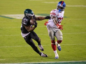 Philadelphia Eagles running back Boston Scott (35) makes a touchdown catch past New York Giants strong safety Jabrill Peppers (21) during the fourth quarter at Lincoln Financial Field Oct. 22, 2020.