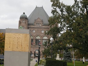 The Sir John A. Macdonald statue remains covered in front of Queen's Park in Toronto, on Tuesday October 20, 2020.