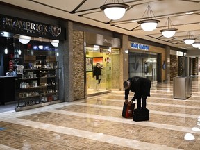 A walks in the near-deserted underground PATH during the lunch hour on Tuesday, October 13, 2020.