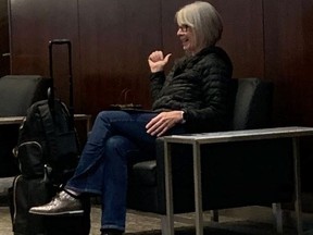 This Twitter image shows Health Minister Patty Hajdu sitting in the Air Canada lounge at Pearson International Airport with no mask on her face.