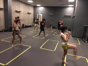 Students practice martial arts while following COVID-19 protocols at Elite Martial Arts Toronto.