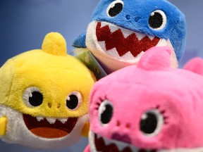 A selection of "Baby Shark" toys are seen on a display at the annual "Toy Fair" at Olympia London on January 22, 2019 in London, England.