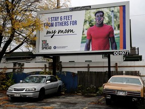 A billboard encourages social distancing as the coronavirus disease (COVID-19) outbreak continues in Milwaukee, Wisconsin, U.S., October 20, 2020.