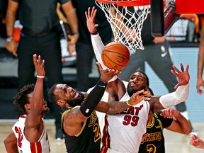 Los Angeles Lakers forward LeBron James (23) shoots the ball against Miami Heat forward Jae Crowder (99) and forward Jimmy Butler (22) during Game 5 of the 2020 NBA Finals at AdventHealth Arena.
