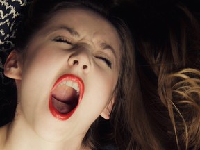 young woman shouting in ecstasy