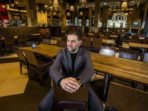 Mohamad Fakih, CEO of Paramount Fine Foods, sits in the empty dining room at the south Etobicoke location at 1585 The Queensway in Toronto, Ont. on Friday, Oct. 23, 2020.