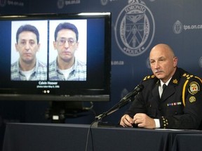 Toronto Police Chief James Ramer sits next to a screen displaying photos of Calvin Hoover during a news conference at Toronto Police Headquarters, Thursday, Oct. 15, 2020. Ramer said DNA evidence indicated Calvin Hoover, then 28, who was known to the girl's family, had sexually assaulted Christine Jessop.