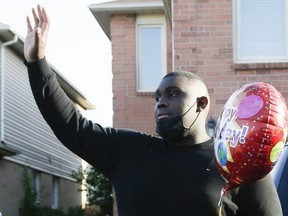 Joshua Telemague is overwhelmed from the support he received on his birthday outside of his Pickering home on Wednesday October 14, 2020. Telemague was a target of anti-black content in a Catholic school yearbook.