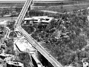 This interesting aerial view from the Toronto Telegram collection was taken in 1964 and looks east across the Don and Rosedale Valleys and highlights the construction of the Bloor-Danforth subway and the TTC's Castle Frank Station. Note the covered section of the subway tracks at the bottom of the photo designed to keep subway noises from disturbing those living nearby. The first section of the subway opened in late February 1966. Visible are the two bridge sections of the Viaduct (top Don Valley Bridge, bottom Rosedale Valley Bridge). Parliament St. is at the bottom of the view. Also visible are the right-of-way of the future Don Valley Parkway, the Don River and Rosedale Valley Rd. The sprawling structure in the centre of the view is the Rosedale Heights School of the Arts.