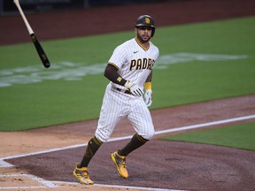 San Diego Padres designated hitter Tommy Pham tosses his bat after drawing a walk against the Seattle Mariners during the second inning at Petco Park in San Diego, Calif., Sept. 18, 2020.