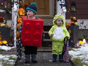 Two young brothers go trick-or-treating in the Westmount area of Edmonton on Tuesday October 31, 2017.