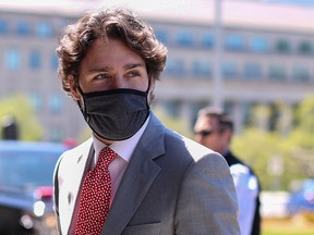 In this file photo taken on May 20, 2020, Prime Minister Justin Trudeau arrives on Parliament Hill to attend a sitting of the Special Committee on the Covid-19 Pandemic in Ottawa.