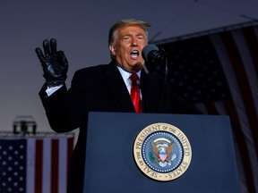 U.S. President Donald Trump gestures as he speaks during a campaign rally at Pittsburgh-Butler Regional Airport in Butler, Pa., Oct. 31, 2020.