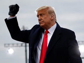 U.S. President Donald Trump gestures as he holds a campaign rally at Reading Regional Airport in Reading, Pa., Oct. 31, 2020.