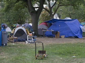 An encampment of tents occupied by the homeless is seen in Toronto's Alexandra Park, at Bathurst and Dundas Sts., on Thursday, Sept. 24, 2020.