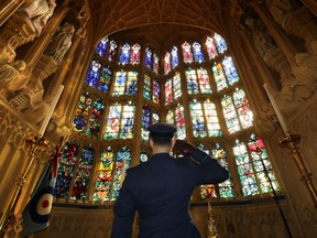 A member of the armed forces salutes at a service marking the 80th anniversary of the Battle of Britain at Westminster Abbey in central London on September 20, 2020.