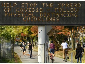 People get exercise along the lakeshore path on Lake Ontario on a fall day during the COVID-19 pandemic in Toronto on Tuesday, September 29, 2020.