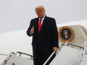 U.S. President Donald Trump gives a thumbs up as he arrives for a campaign event, at Murtha Johnstown-Cambria County Airport, in Johnstown, Pa, Monday, Oct. 26, 2020.