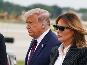 U.S. President Donald Trump and First Lady Melania Trump arrive at Cleveland Hopkins International Airport in Cleveland, Ohio, on Friday, Oct. 2, 2020 after contracting Covid-19.
