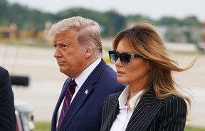 U.S. President Donald Trump and First Lady Melania Trump arrive at Cleveland Hopkins International Airport in Cleveland, Ohio, on Friday, Oct. 2, 2020 after contracting Covid-19.
