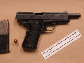 An image released by Halton Regional Police of a handgun allegedly seized during a traffic stop on James Snow Parkway in Milton on Oct. 8, 2020.
