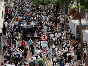 Anti-national security law protesters march during the anniversary of Hong Kong's handover to China from Britain, in Hong Kong, China July 1, 2020.
