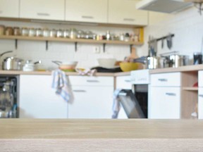 A roommate wonders how address a flatmate's kitchen clutter.