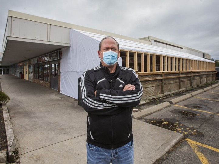  Rick Hugglestone, owner of Mulligan’s Pub, stand outside the covered patio in Mississauga, Ont. on Saturday, Oct. 24, 2020.