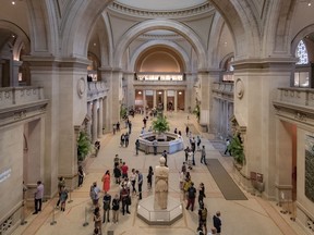Visitors wearing masks line up during the public reopening of New York's Metropolitan Museum of Art in August.