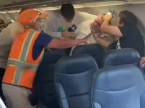 A brawl erupted on board Allegiant Air Flight 607 from Mesa, Ariz., to Provo, Utah, after a passenger refused to wear a mask believing his face shield was sufficient on Saturday, Oct. 3, 2020.