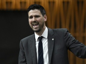 Parliamentary Secretary to the Minister of Finance and to the Minister of Middle Class Prosperity Sean Fraser rises during Question Period in the House of Commons on Parliament Hill in Ottawa, Feb. 28, 2020.