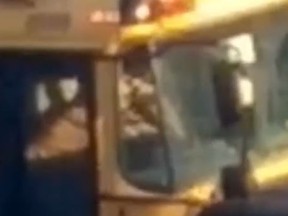 Still frame of a video capturing a Francobus school bus driver smoking in his bus