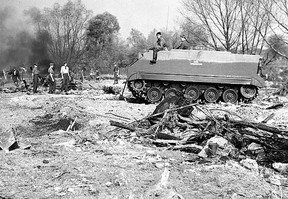 It took weeks to complete the search for Hurricane Hazel’s victims. Some were never found. In this photo members of the Canadian Army Reserve use a piece of heavy mechanized equipment to help in the search.