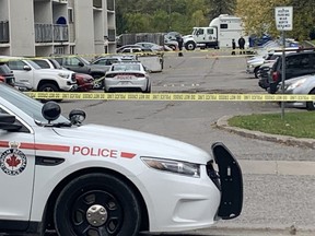 Durham Regional Police at the scene of a shooting death the night before at an apartment building in Oshawa, Tuesday, Oct. 6, 2020
