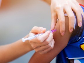 A child receives a vaccination shot.