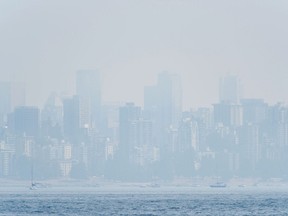In this file photo taken on Aug. 21, 2018 shows the Vancouver skyline under heavy haze as seen from Jericho Beach.