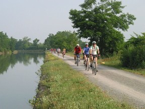 Cyclists are pictured on a section of the Empire State Trail
called the WNY Erie Canalway.