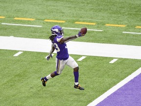 Vikings' Dalvin Cook runs the ball in for a touchdown against the Detroit Lions.