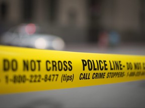 Police tape is shown at the scene of a fire in Toronto Tuesday, May 2, 2017.