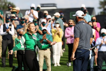 Dustin Johnson of the United States celebrates with fiancée Paulina Gretzky after winning the Masters at Augusta National Golf Club on November 15, 2020 in Augusta, Georgia.